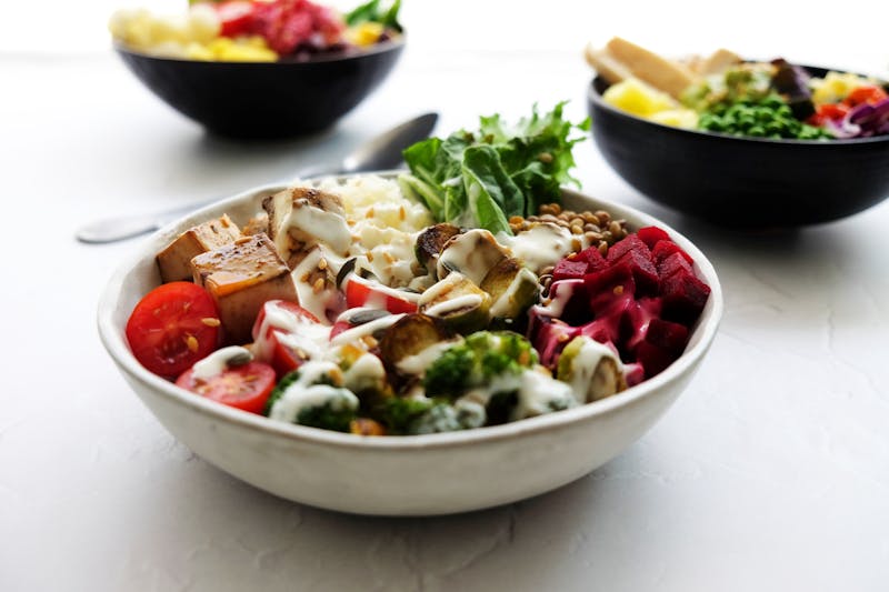 Buddha veggie bowl with colorful vegetables and dressing