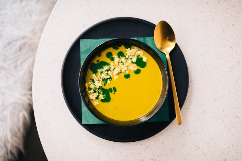 Fresh herbs and ingredients on a wooden surface